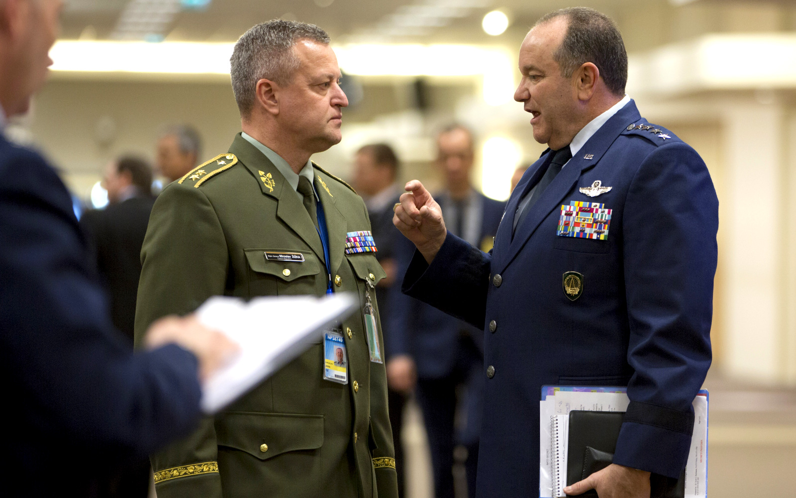 Supreme Allied Commander Europe, Gen. Philip Breedlove, right, speaks with Czech Republic's NATO-EU military representative Maj. Gen. Miroslav Zizka, center, prior to a meeting at NATO headquarters in Brussels on Wednesday, Feb. 10, 2016. NATO defense ministers convene a two-day meeting to discuss current defense issues and whether the Alliance should take a more direct role in dealing with its gravest migrant crisis since WWII. (AP Photo/Virginia Mayo, Pool)