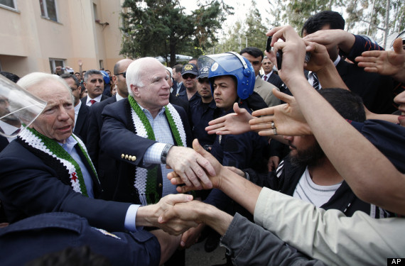 Independent U. S. Sen. Joe Lieberman of Connecticut, left, and Republican Sen. John McCain, of Arizona are seen at a Syrian refugee camp in Yayladagi, Turkey, Tuesday, April 10, 2012. (AP/Umit Bektas)