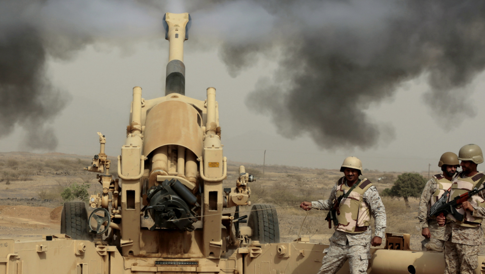 Saudi soldiers fire artillery toward three armed vehicles approaching the Saudi border with Yemen in Jazan, Saudi Arabia. (AP Photo/Hasan Jamali)