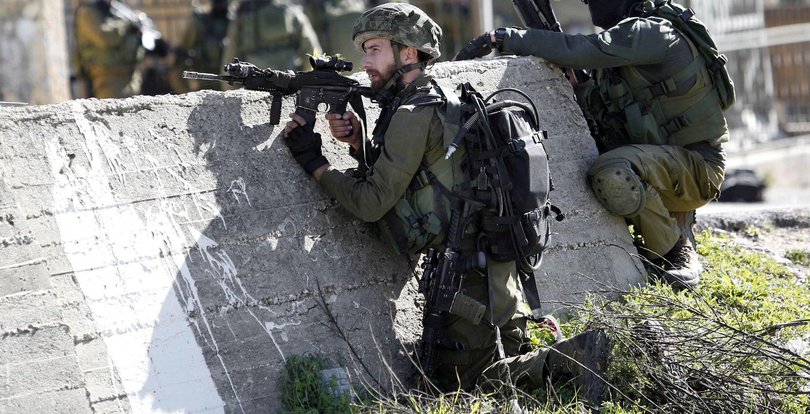 Israeli soldiers during their early morning raid on Amari Palestinian refugee camp, near the West Bank city of Ramallah. Monday, Feb. 15, 2016. (AP Photo/Nasser Shiyoukhi).
