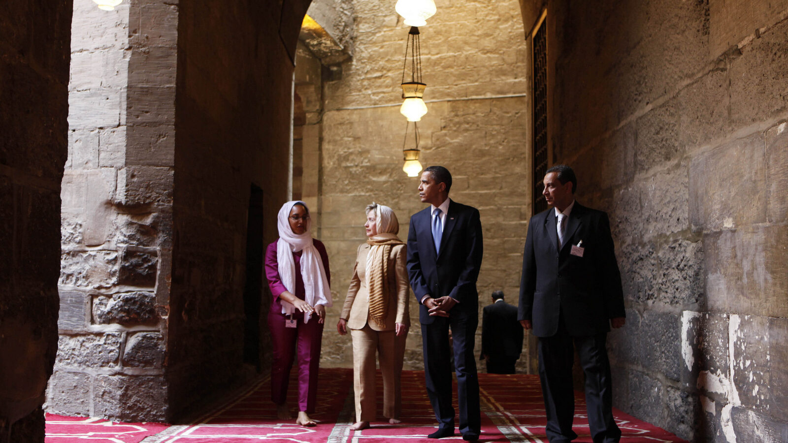 In this Thursday, June 4, 2009 file photo, U.S. President Barack Obama, 2nd right, tours the Sultan Hassan Mosque in Cairo, Egypt, with U.S. Secretary of State Hillary Rodham Clinton, 2nd left, Iman Abdel Fateh at left and Dr. Zahi Hawass, right. Obama's first visit to a U.S. mosque comes as Muslim-Americans say they're confronting increasing levels of bias in speech and deeds. Obama is scheduled to visit the Islamic Society of Baltimore on Wednesday, Feb. 3, 2016. (AP Photo/Gerald Herbert)