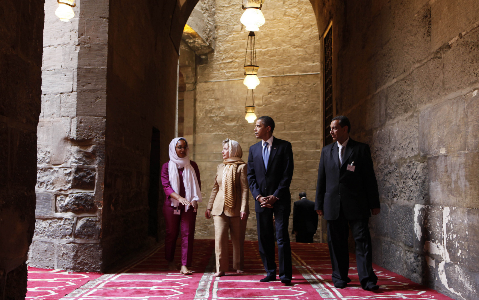 In this Thursday, June 4, 2009 file photo, U.S. President Barack Obama, 2nd right, tours the Sultan Hassan Mosque in Cairo, Egypt, with U.S. Secretary of State Hillary Rodham Clinton, 2nd left,  Iman Abdel Fateh at left and Dr. Zahi Hawass, right. Obama's first visit to a U.S. mosque comes as Muslim-Americans say they're confronting increasing levels of bias in speech and deeds. Obama is scheduled to visit the Islamic Society of Baltimore on Wednesday, Feb. 3, 2016. (AP Photo/Gerald Herbert)