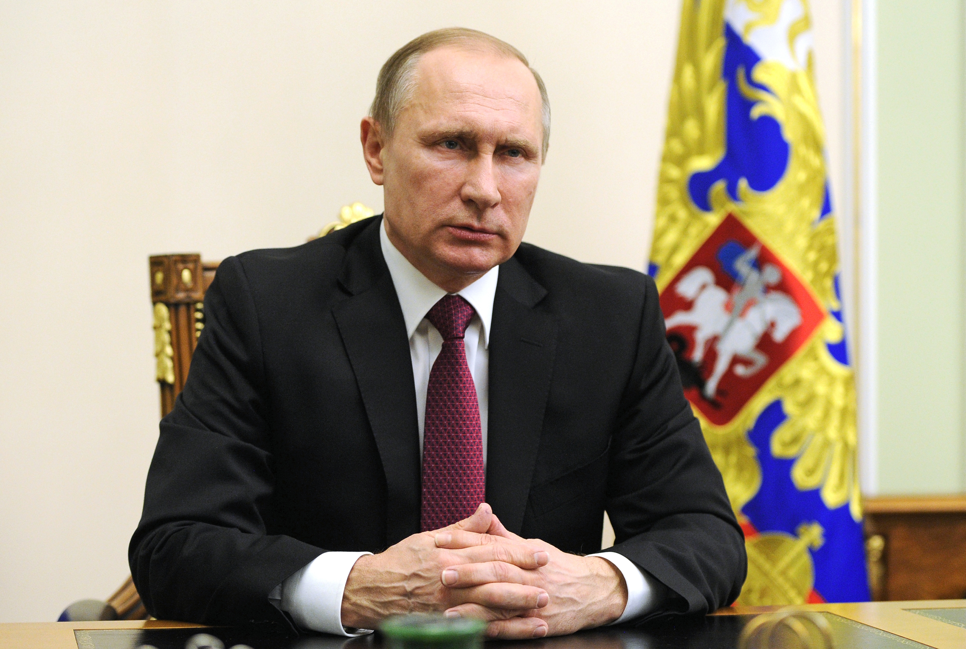 Russian President Vladimir Putin is seen during his speech with a special message after his telephone conversation with U.S. President Barack Obama at the Novo-Ogaryovo residence outside Moscow, Russia, Monday, Feb. 22, 2016. The U.N. special envoy for Syria, Staffan de Mistura, says the cease-fire reached by the United States and Russia and set to begin at midnight Saturday in Syria gives the two world powers the task of making sure that everyone else abides by it, too. (Mikhail Klimentyev/ Sputnik, Kremlin Pool Photo via AP)