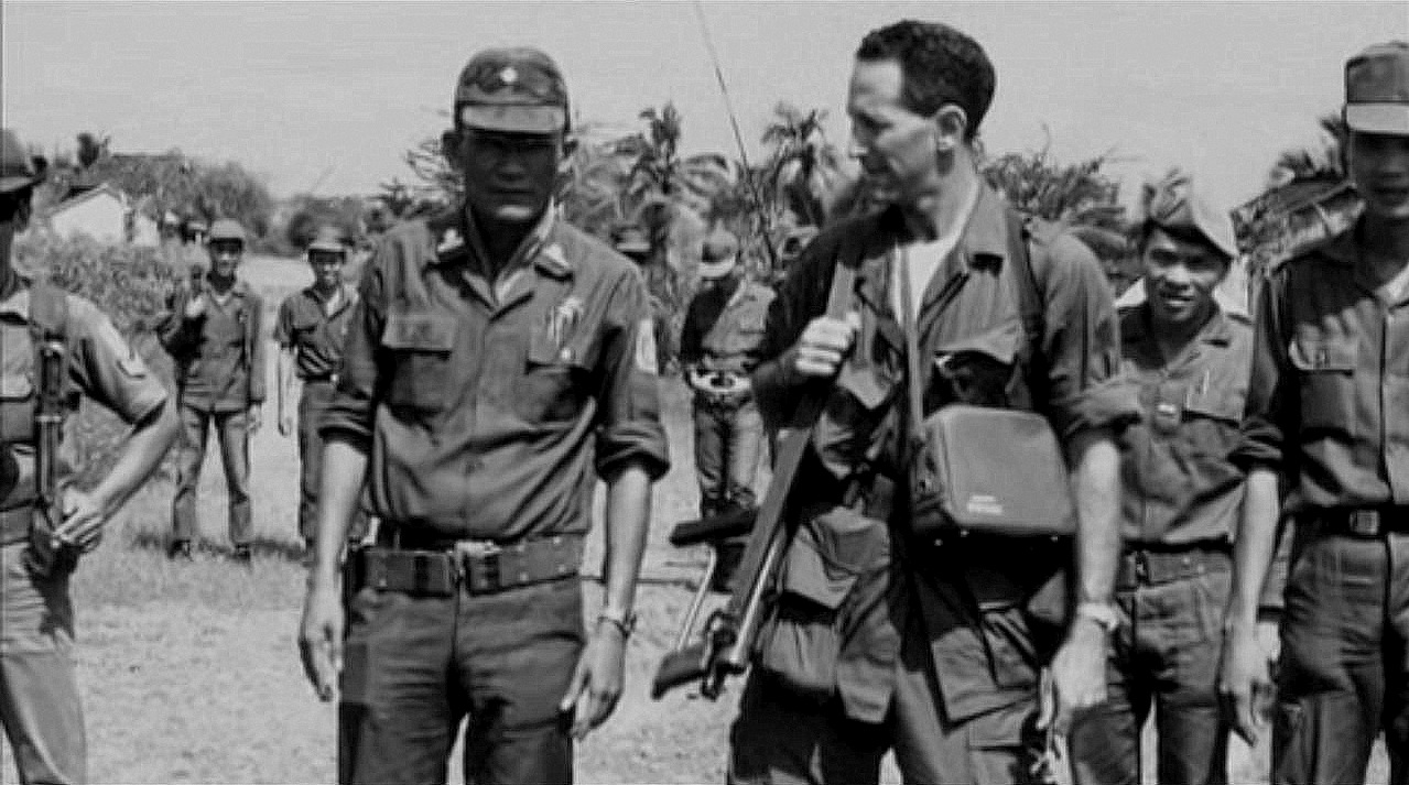 Daniel Ellsberg speaks with a Vietnamese soldier during his deployment to Vietnam.