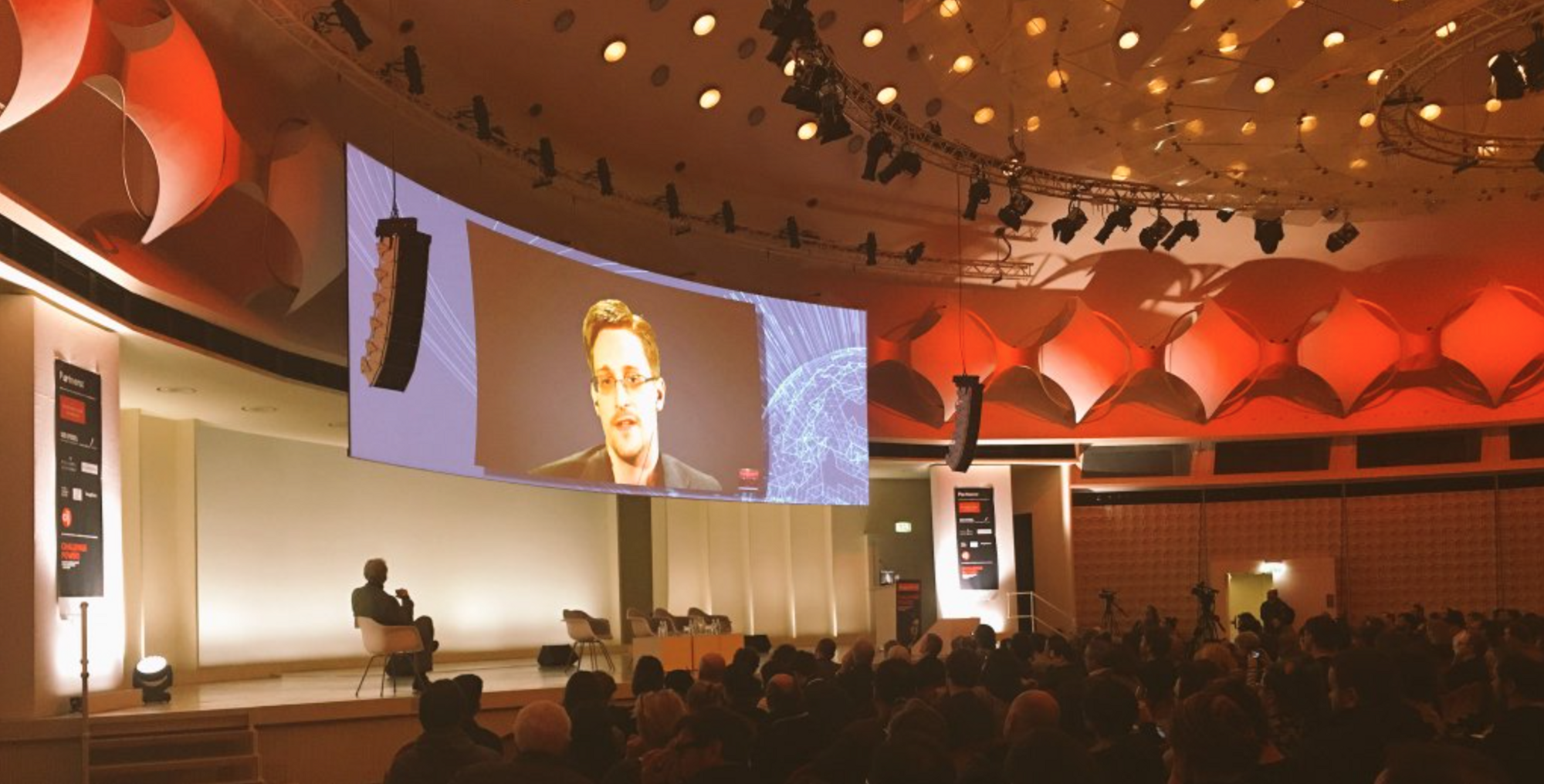 Edward Snowden addressing an audience live in Berlin via video link on Saturday evening.