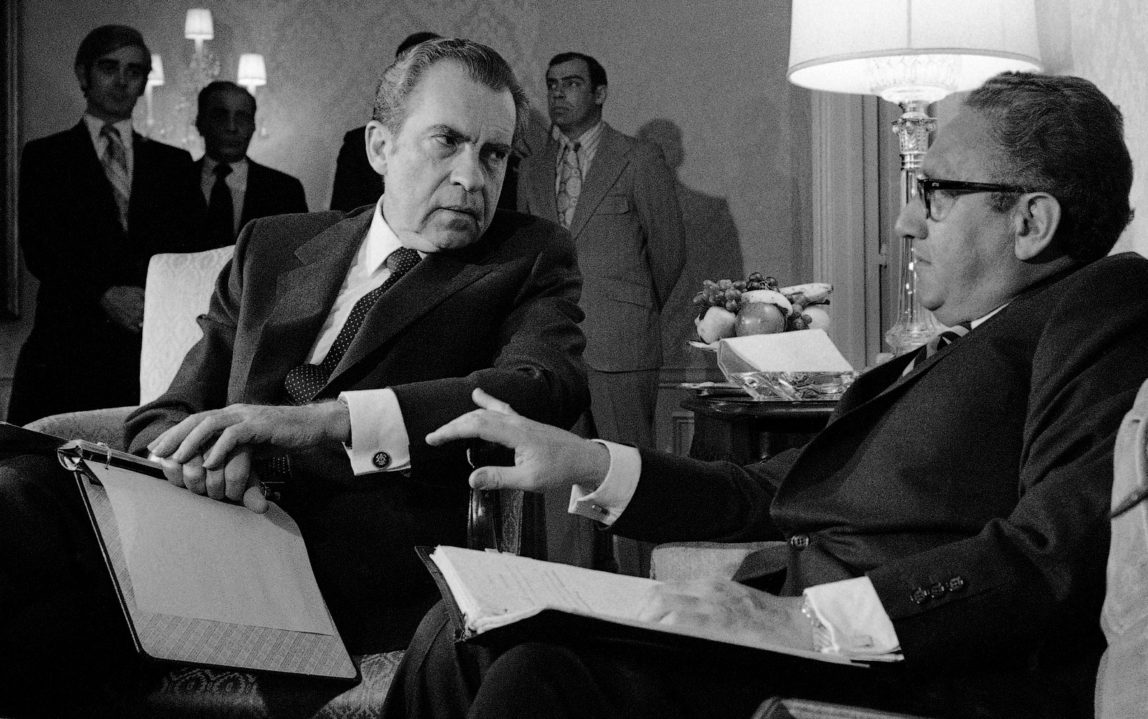 President Nixon confers with then National Security adviser, and current war criminal Henry Kissinger, Nov. 25, 1972. (AP Photo)