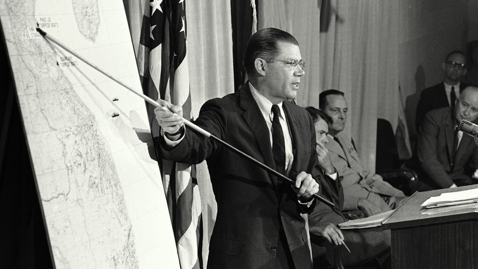 Sec. of Defense Robert McNamara indicates on a map where U.S. Navy aircraft made strikes at North Vietnamese PT boats and their shore bases in retaliation for the two attacks on American craft in the Gulf of Tonkin at a Pentagon news briefing, Aug. 5, 1964, Washington, D.C. The account came within hours of an announcement by Pres. Lyndon B. Johnson of the decision to hit back hard in reply to the attacks. (AP Photo)
