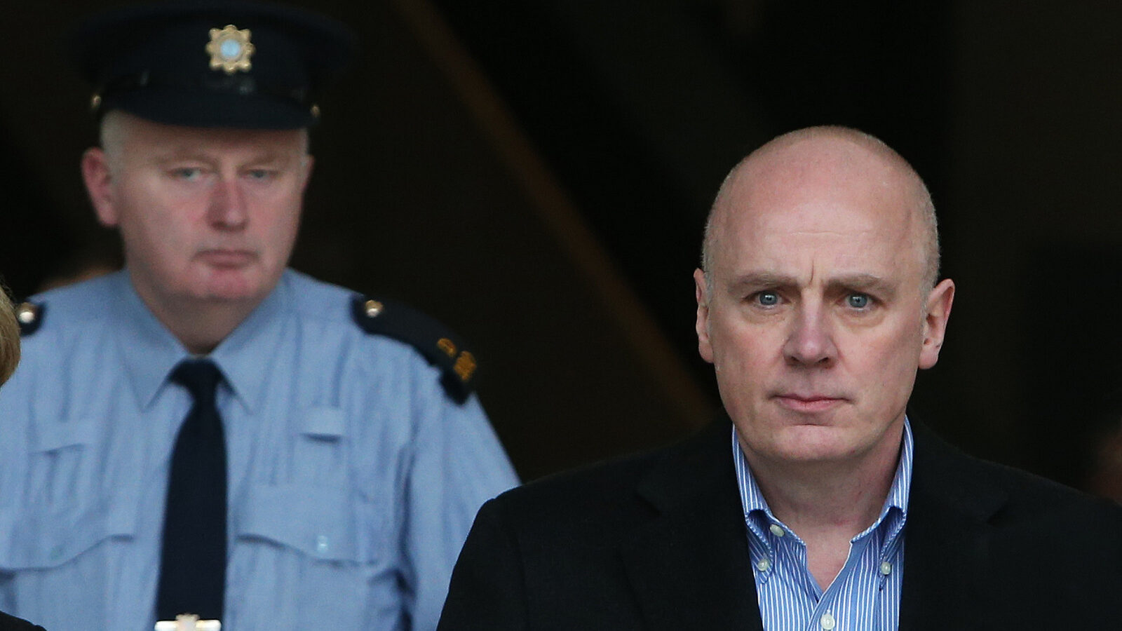 Former Anglo Irish Bank chief executive David Drumm walks free from Central Criminal Court in Dublin, Ireland Tuesday March 15, 2016, after he and relatives lodged 150,000 euros for his bail on 33 fraud charges. Drumm was extradited from Boston to Dublin on Monday after spending seven years in the United States seeking to gain U.S. bankruptcy protection and avoid facing 33 Irish fraud charges connected to Anglo’s 2009 nationalization and collapse. Court officials expect his trial to begin in mid-2017. (Brian Lawless/PA via AP) UNITED KINGDOM OUT NO SALES NO ARCHIVE