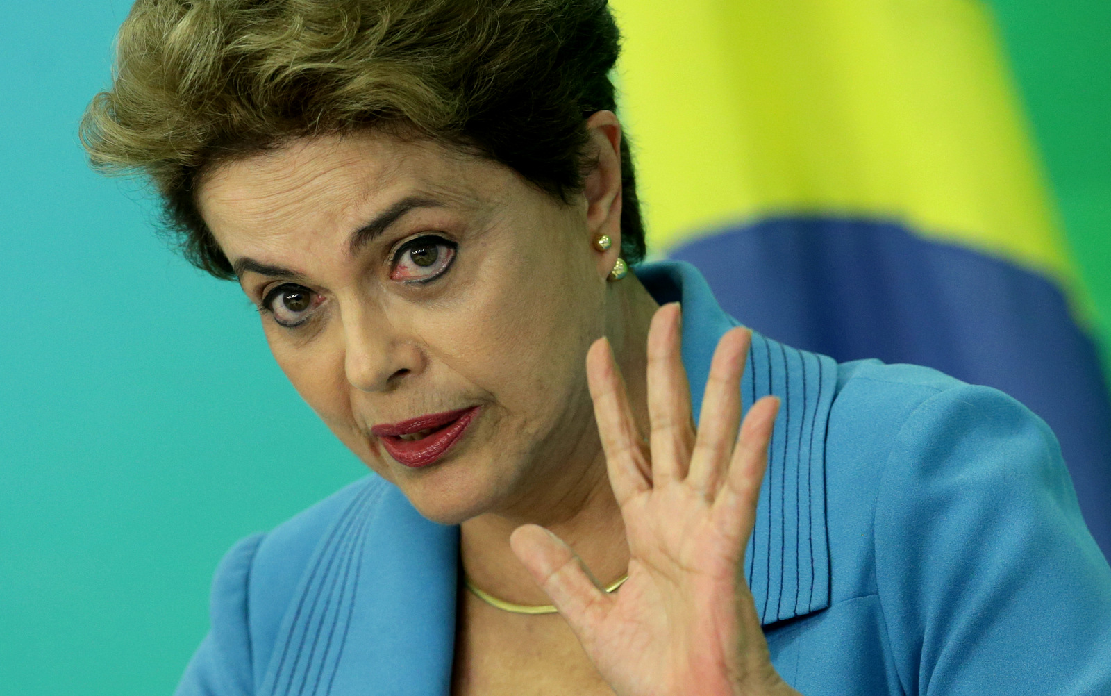 Brazil's President Dilma Rousseff speaks during a press conference about her impeachment process, at Planalto Presidential Palace, in Brasilia, Monday, April 18, 2016. President Rousseff appeared on the verge of losing office after a congressional vote to impeach her and signs suggested only tenuous support for her in the Senate, which will decide whether to remove her amid a political and economic crisis. (AP Photo/Eraldo Peres)
