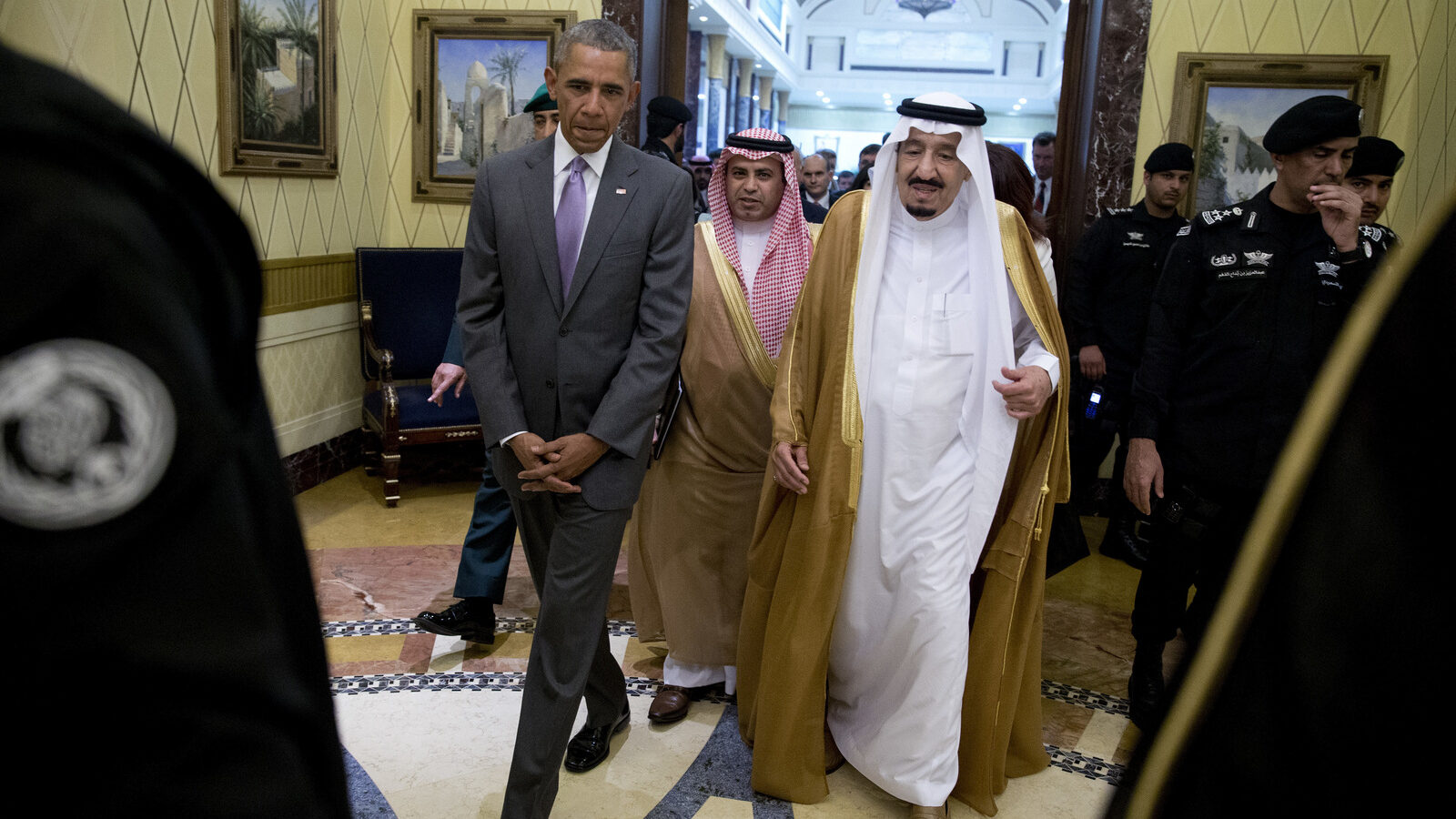 President Barack Obama and Saudi Arabia's King Salman walk together to a meeting at Erga Palace in Riyadh, Saudi Arabia, Wednesday, April 20, 2016. The President begins a six day trip to strategize with his counterparts in Saudi Arabia, England and Germany on a broad range of issues with efforts to rein in the Islamic State group being the common denominator in all three stops. (AP Photo/Carolyn Kaster)