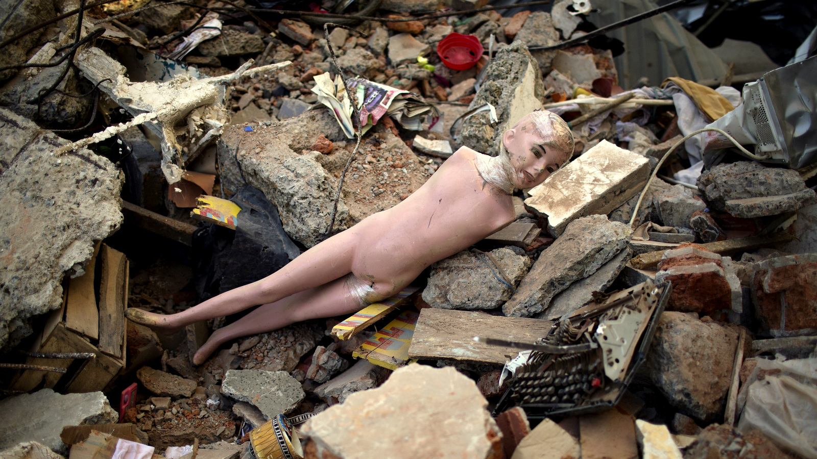A mannequin lies amid the rubble caused by a 7.8-magnitude earthquake, in La Chorrera, Ecuador, Monday, April 18, 2016. The Saturday night quake left a trail of ruin along Ecuador’s normally placid Pacific Ocean coast. At least 350 people died and thousands are homeless. President Rafael Correa said early Monday that the death toll would “surely rise, and in a considerable way.” (AP Photo/Rodrigo Abd)