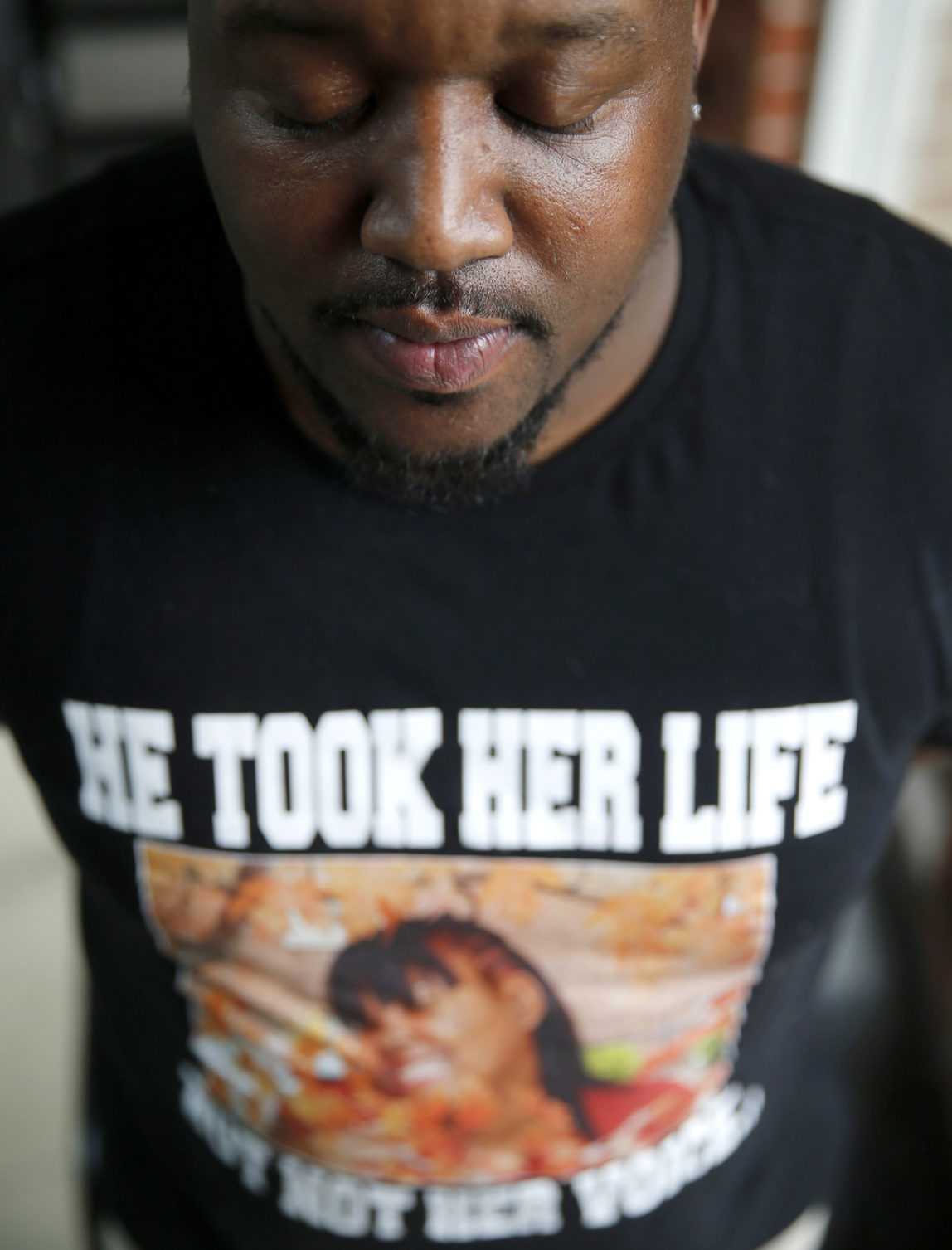 In this March 4, 2016 photo, Martinez Sutton wears a shirt commemorating his sister, Rekia Boyd, 22, who was shot and killed in 2012 by a Chicago police officer. Sutton has been pushing for the firing of officer Dante Servin, who, while off-duty, was driving in an alley when he argued with a group of people. Servin fired several shots over his shoulder, striking a Boyd with a fatal head wound. (AP Photo/Charles Rex Arbogast)