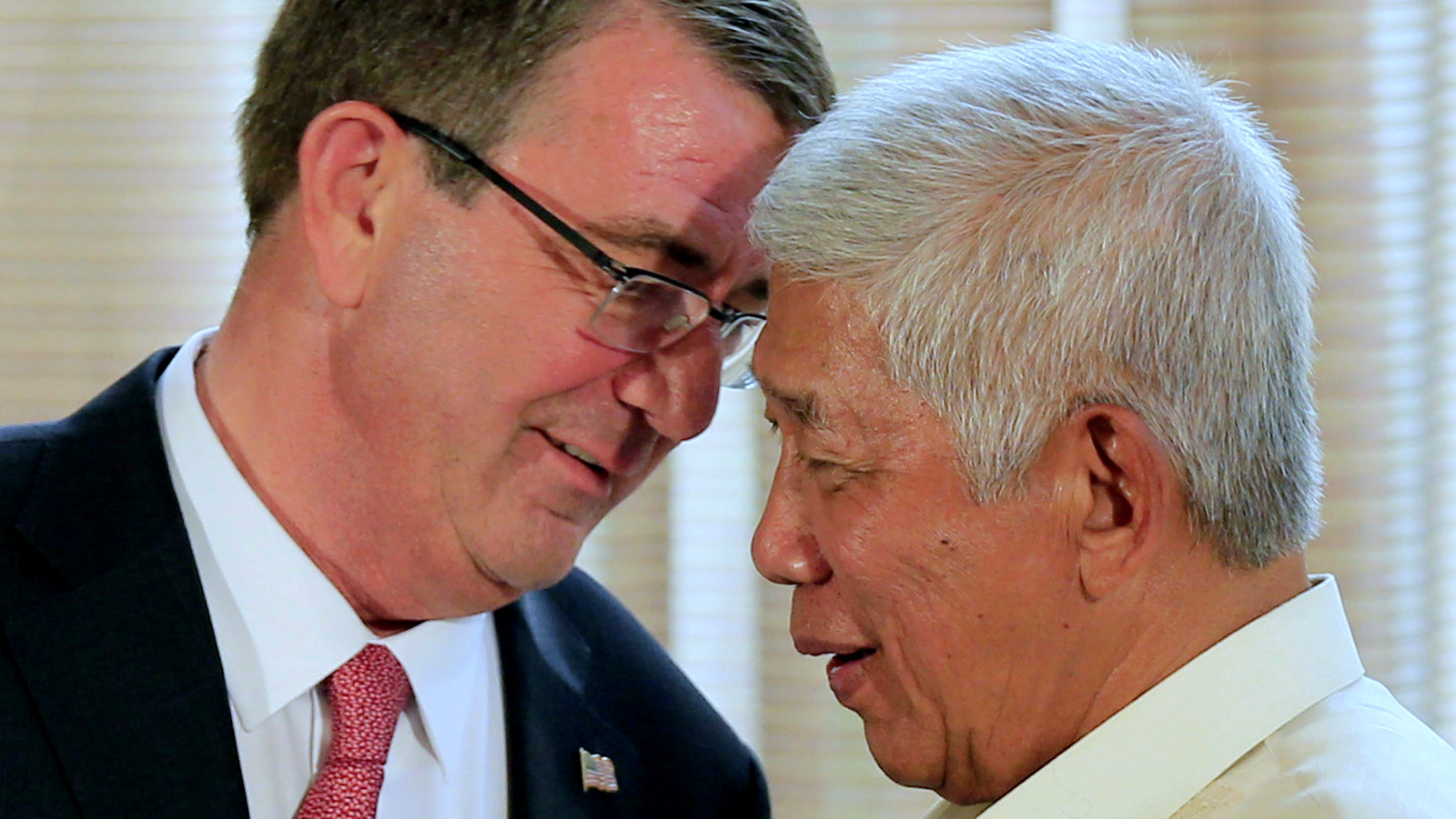U.S. Defense Secretary Ash Carter, left, talks with his Philippine counterpart Voltaire Gazmin during their joint press conference at the Malacanang presidential palace in Manila, Philippines on Thursday, April 14, 2016. The United States on Thursday revealed for the first time that American ships have started conducting joint patrols with the Philippines in the South China Sea, a somewhat rare move not done with many other partners in the region. (Romeo Ranoco/Pool Photo via AP)