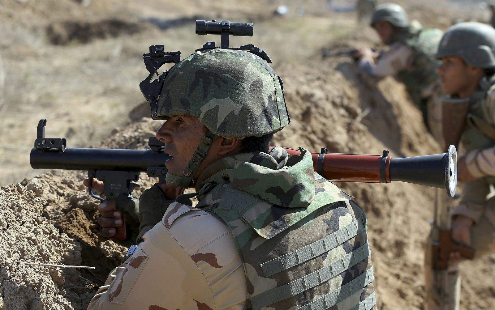 Iraqi security forces participate in a drill with U.S. forces train them in Taji, north of Baghdad, Iraq.