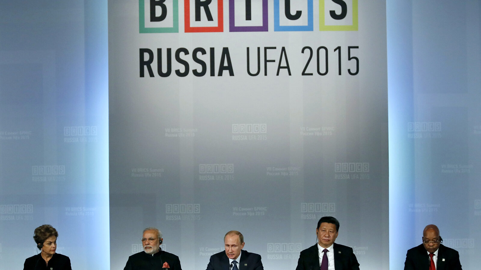 From left: Brazil's President Dilma Rousseff , Indian Prime Minister Narendra Modi, President of Russia Vladimir Putin, President of China Xi Jinping and South African President Jacob Zuma sit during a signing ceremony at the BRICS Summit in Ufa, Russia, Thursday, July 9, 2015. Ufa is hosting BRICS (Brazil, Russia, India, China and South Africa) and SCO (Shanghai Cooperation Organisation) summits. (Sergei Ilnitsky/Pool photo via AP)