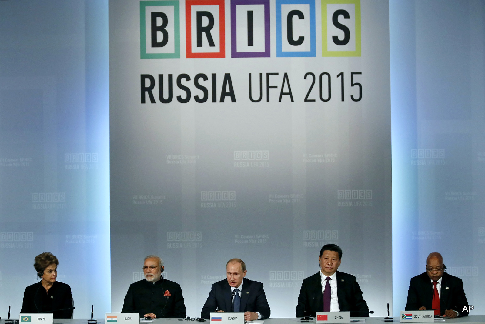 From left: Brazil's President Dilma Rousseff , Indian Prime Minister Narendra Modi, President of Russia Vladimir Putin, President of China Xi Jinping and South African President Jacob Zuma sit during a signing ceremony at the BRICS Summit in Ufa, Russia, Thursday, July 9, 2015. Ufa is hosting BRICS (Brazil, Russia, India, China and South Africa) and SCO (Shanghai Cooperation Organisation) summits. (Sergei Ilnitsky/Pool photo via AP)