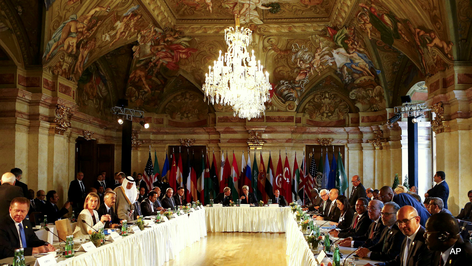 U.S. Secretary of State John Kerry , center, , Italian Foreign Minister Paolo Gentiloni , left, and U.N. Libya envoy Martin Kobler attend the ministerial meeting on Libya in Vienna, Austria, Monday May 16, 2016. (Leonhard Foeger/Pool Photo via AP)