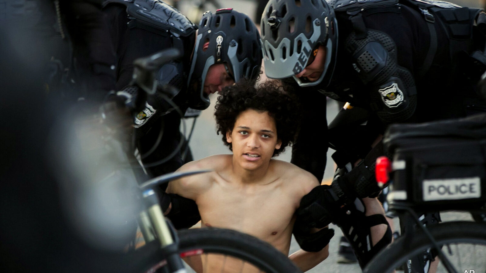 Seattle Police arrest a protester on 4th Avenue South in Sodo during the annual May Day protest and march Sunday, May 1, 2016, in Seattle, Wash.