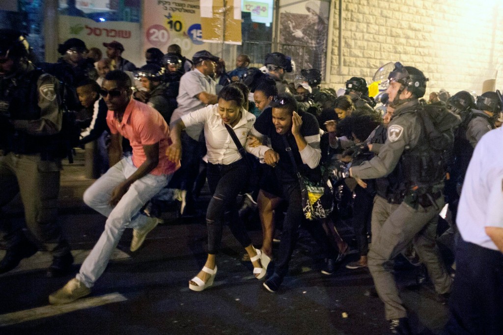 Israeli officers assault Ethiopians protesting police brutality.
