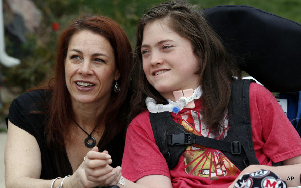 Stacey Linn jokes with her 15-year-old son, Jack, who has cerebral palsy, but is not allowed to wear a skin patch delivering a cannabis-derived treatment to school. A new Colorado law allowing medical marijuana use at public schools will be looked at by state lawmakers Monday because no school districts are allowing it even though the law says they can.