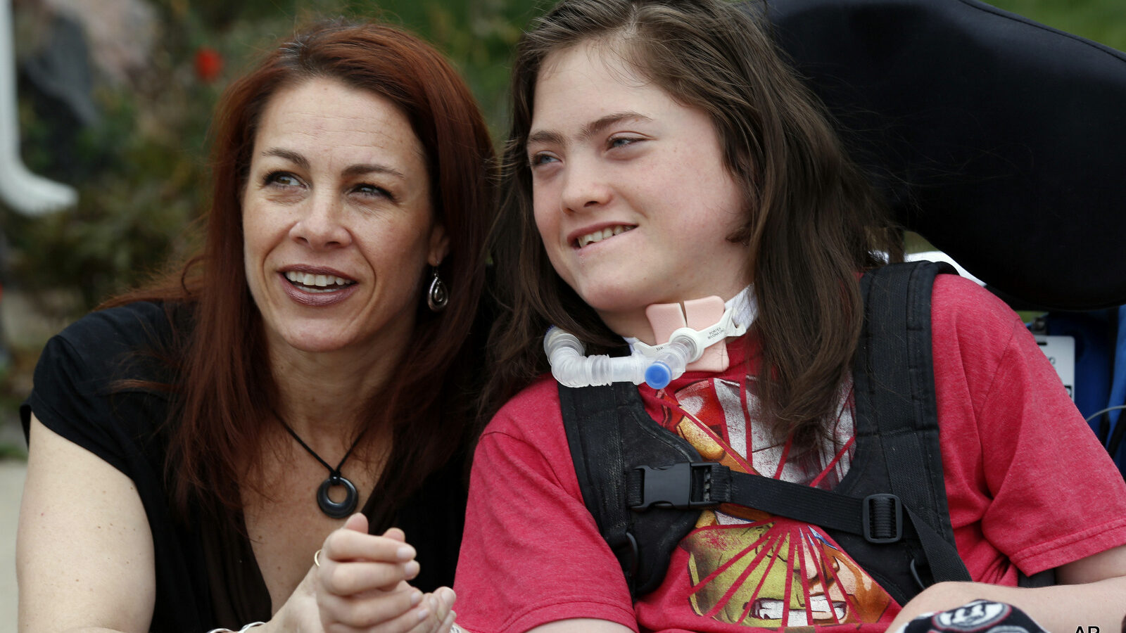 Stacey Linn jokes with her 15-year-old son, Jack, who has cerebral palsy, but is not allowed to wear a skin patch delivering a cannabis-derived treatment to school. A new Colorado law allowing medical marijuana use at public schools will be looked at by state lawmakers Monday because no school districts are allowing it even though the law says they can.