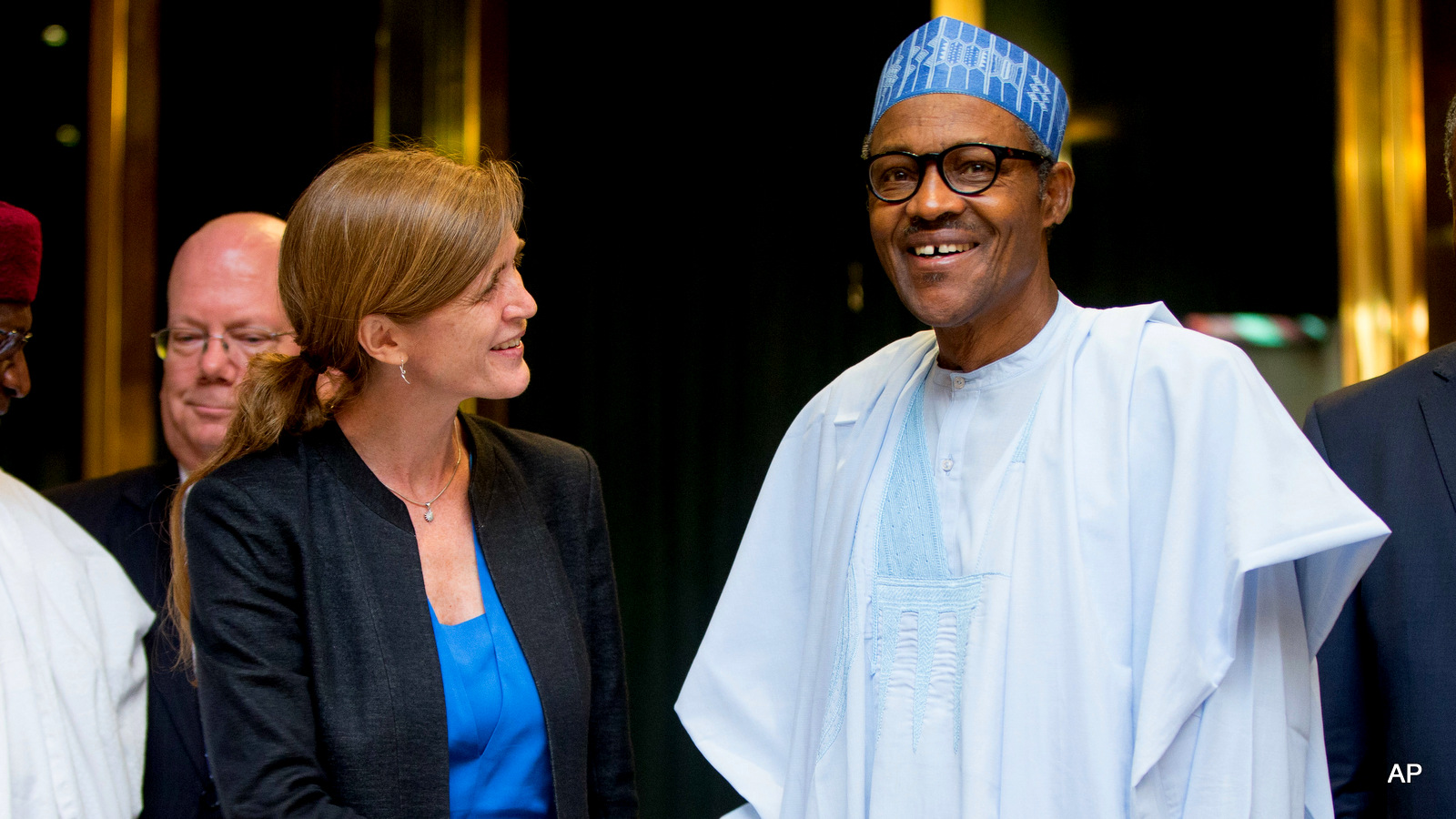 U.S. Ambassador to the United Nations Samantha Power, center left, shakes hands with Nigeria's President Muhammadu Buhari, center right, after meeting at the Presidential Villa in Abuja, Nigeria, Thursday, April 21, 2016. 