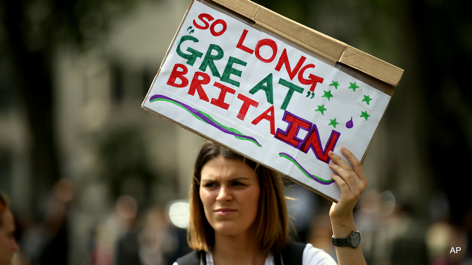 Demonstrators opposing Britain's exit from the European Union in Parliament Square following an EU referendum result hold a protest in London, Saturday, June 25, 2016. According to the Muslim Council for Britain (MCB) there have been more than 100 reports of 'hate crimes' against Muslims since the Brexit result.