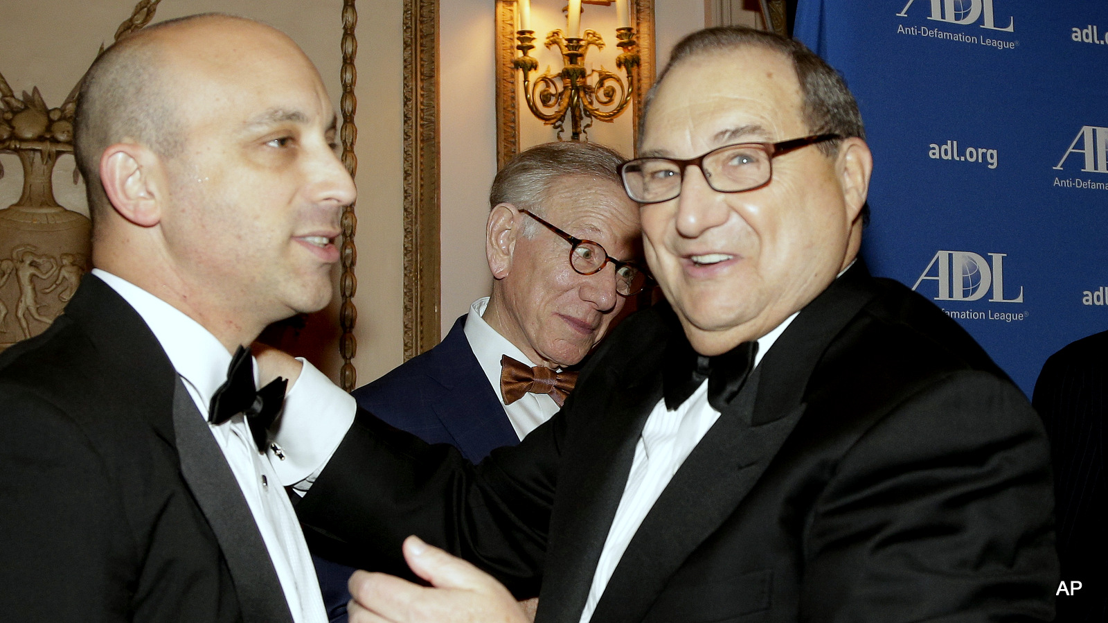 Jonathan Greenblatt, left, incoming national director for the Anti-Defamation League, talks with Abe Foxman, former director of the ADL, during a reception for a special dinner in Foxman's honor in New York.