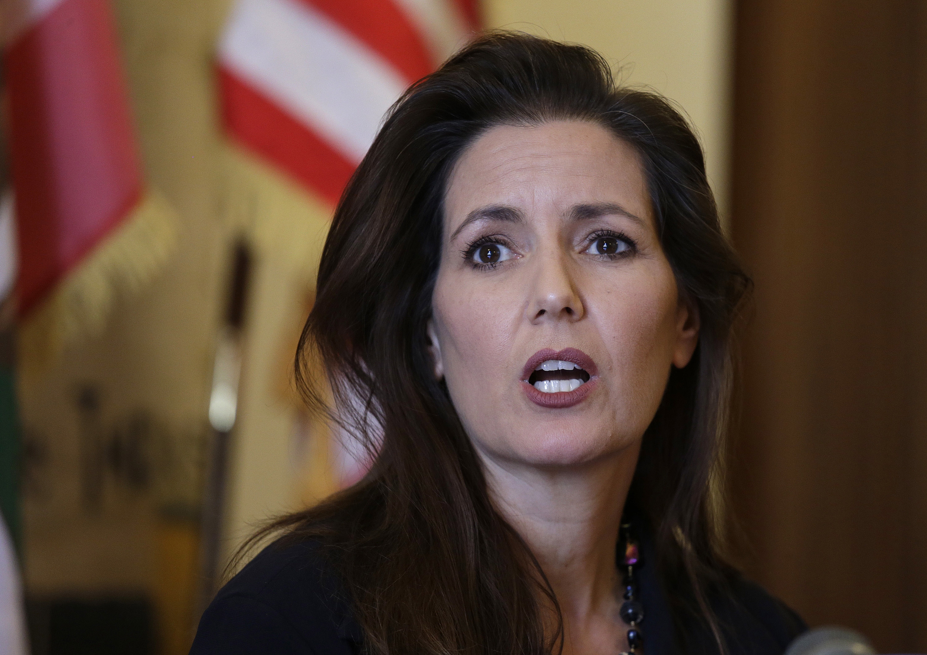 Oakland Mayor Libby Schaaf answering questions during a news conference at City Hall in Oakland, Calif. Another Oakland police chief has stepped down after two days on the job. Acting Police Chief Paul Figueroa is the third chief to be replaced in nine days amid a sex scandal that the city's mayor said involved "disgusting allegations" that a number of officers had sex with a teenage prostitute. Schaaf said Friday, June 17, 2016,  her job is to "run a police department, not a frat house." (AP Photo/Eric Risberg, File)