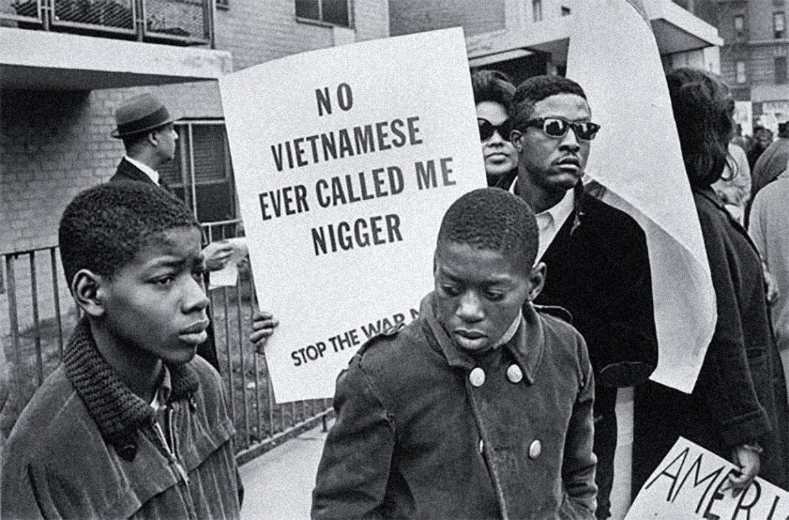 Demonstrators against the U.S. war on Vietnam in the Harlem Peace March carry the words of Muhammad Ali.