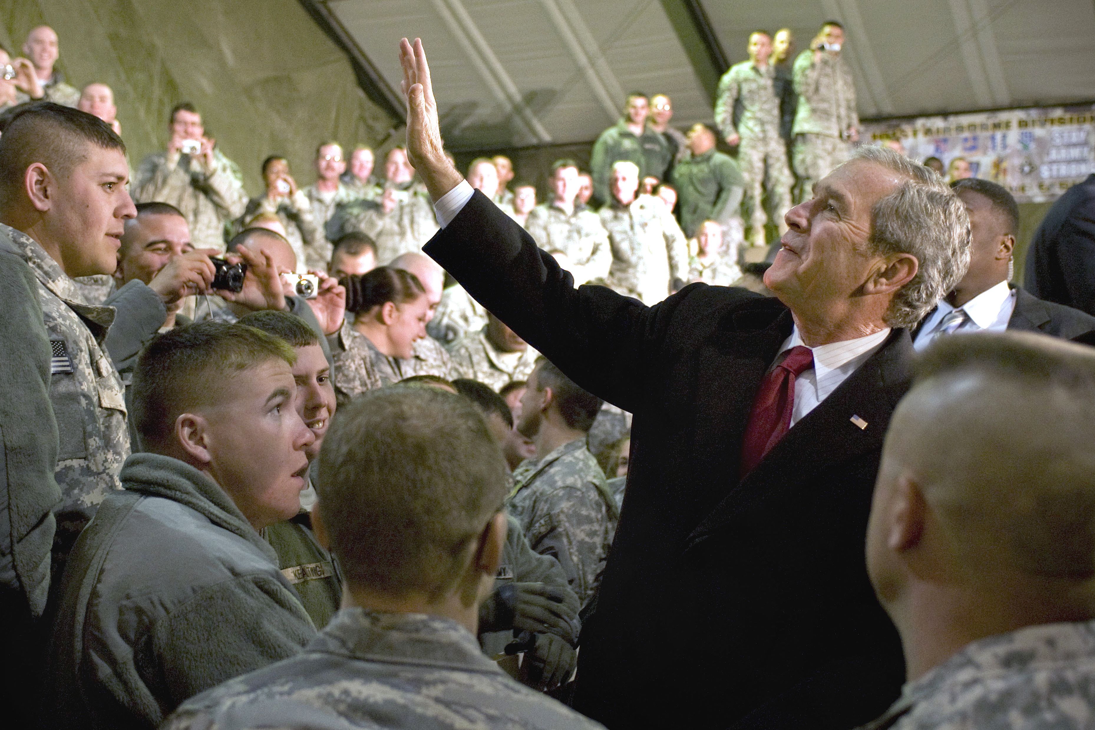 President George W. Bush waves to military members at Bagram Air Field, Afghanistan, Dec. 15. (U.S. Air Force photo by Staff Sgt. Samuel Morse)(Released)