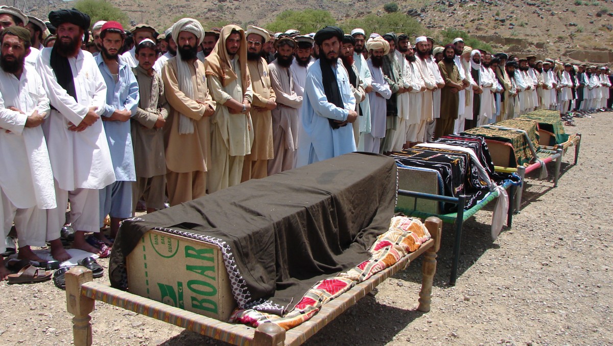 Pakistani villagers offer funeral prayers for people killed by a U.S. drone attack in Miranshah, capital of Pakistani tribal region of North Waziristan along the Afghanistan border. (AP/Hasbunullah)