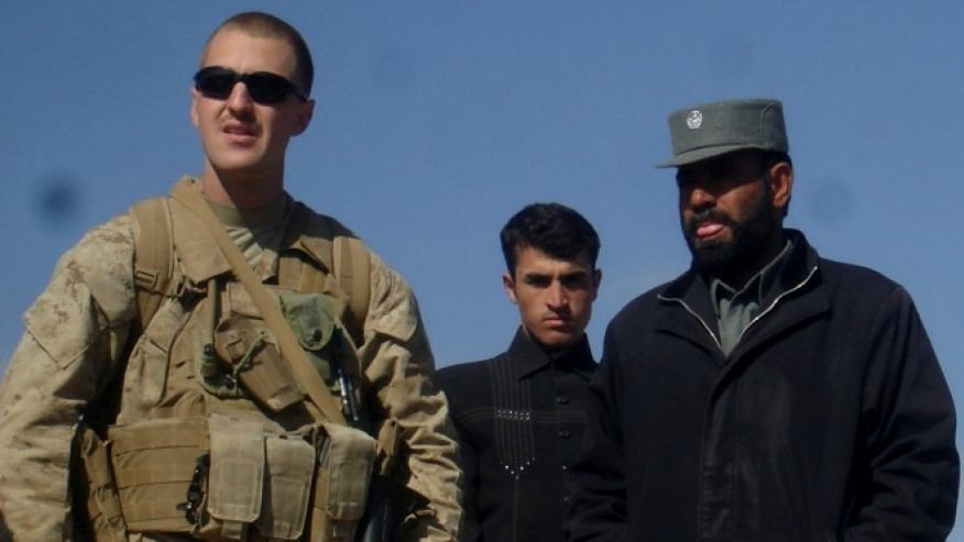 Marine reservist Jason Brezler, left, is pictured with Afghan police chief Sarwar Jan.
