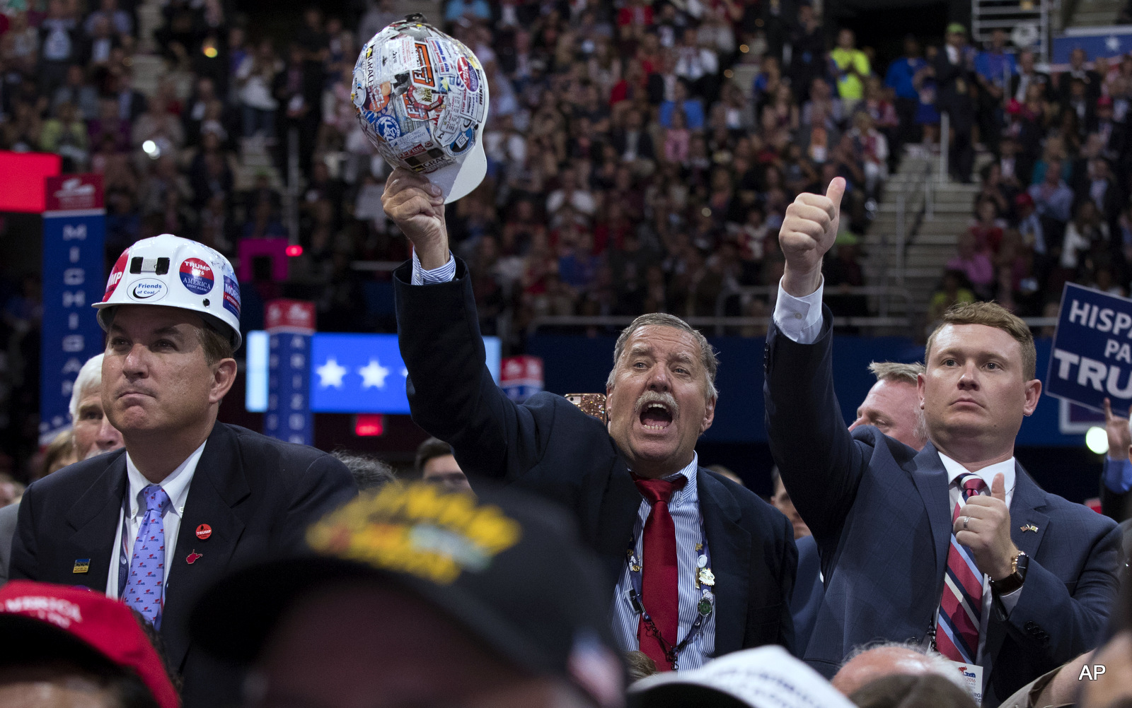 People cheer as Republican presidential candidate Donald Trump speaks during the final night of the Republican National Convention, Thursday, July 21, 2016, in Cleveland. 