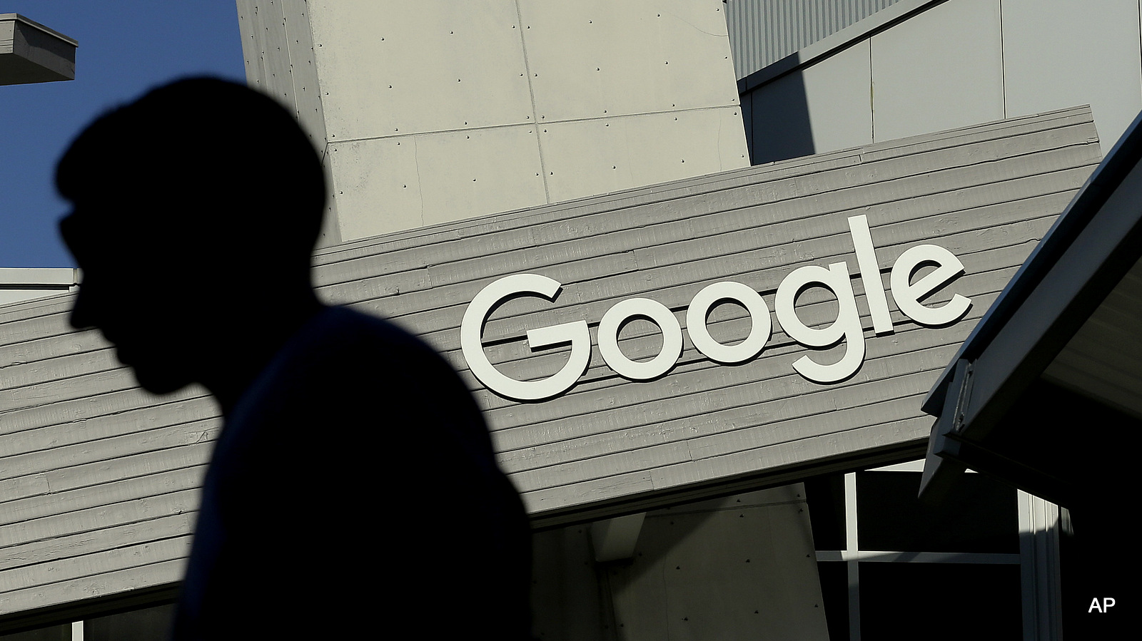 A man walks past a building on the Google campus in Mountain View, Calif. Google recently noted ‘Usage of our services have increased every year, and so have the user data request number.’