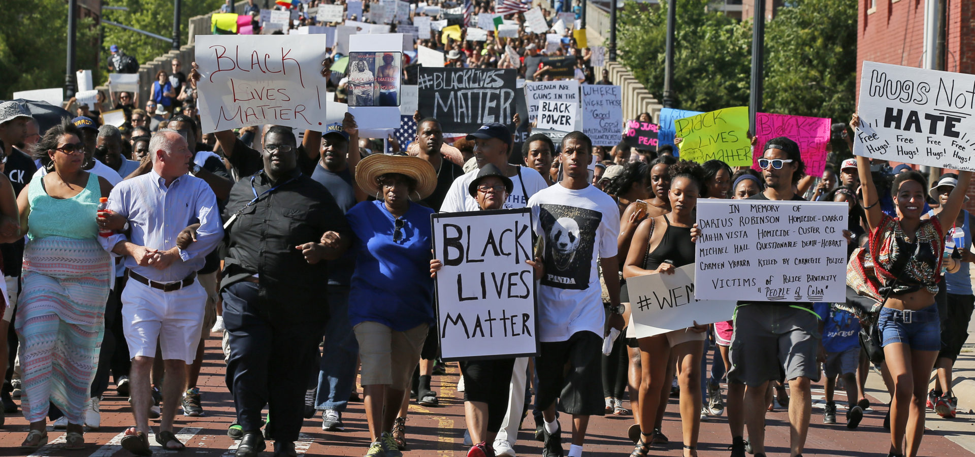 People march in a Black Lives Matter rally in Oklahoma City, Sunday, July 10, 2016.