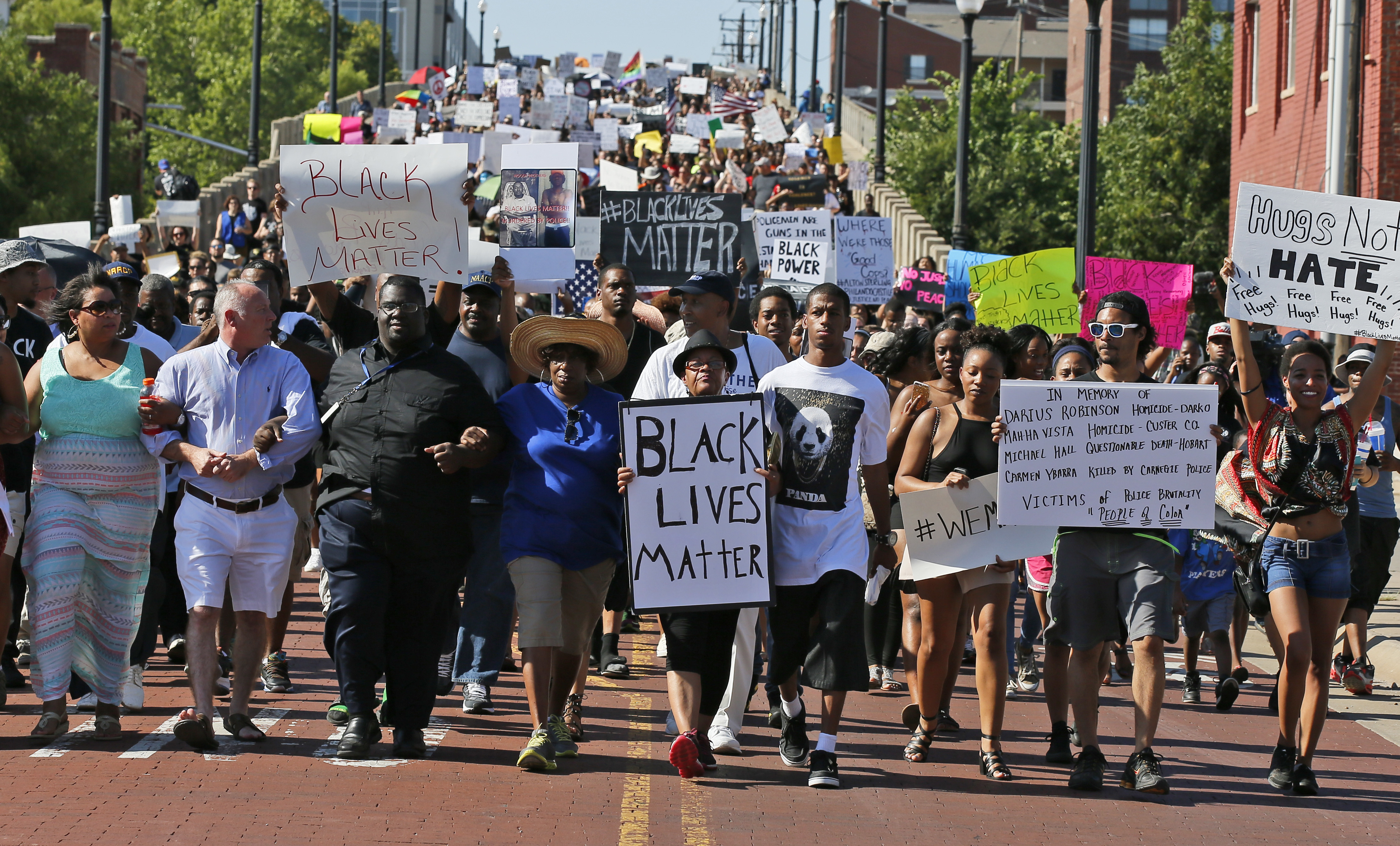 People march in a Black Lives Matter rally in Oklahoma City, Sunday, July 10, 2016. 