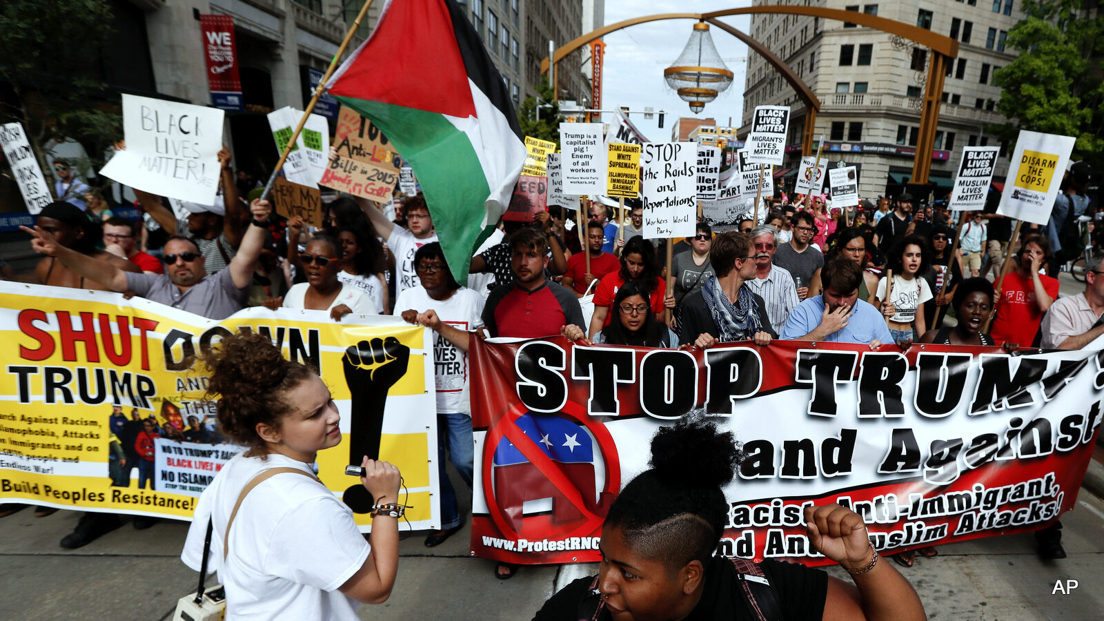 Demonstrators march during the Shut Down Trump at the RNC protest on Sunday, July 17, 2016, in Cleveland.