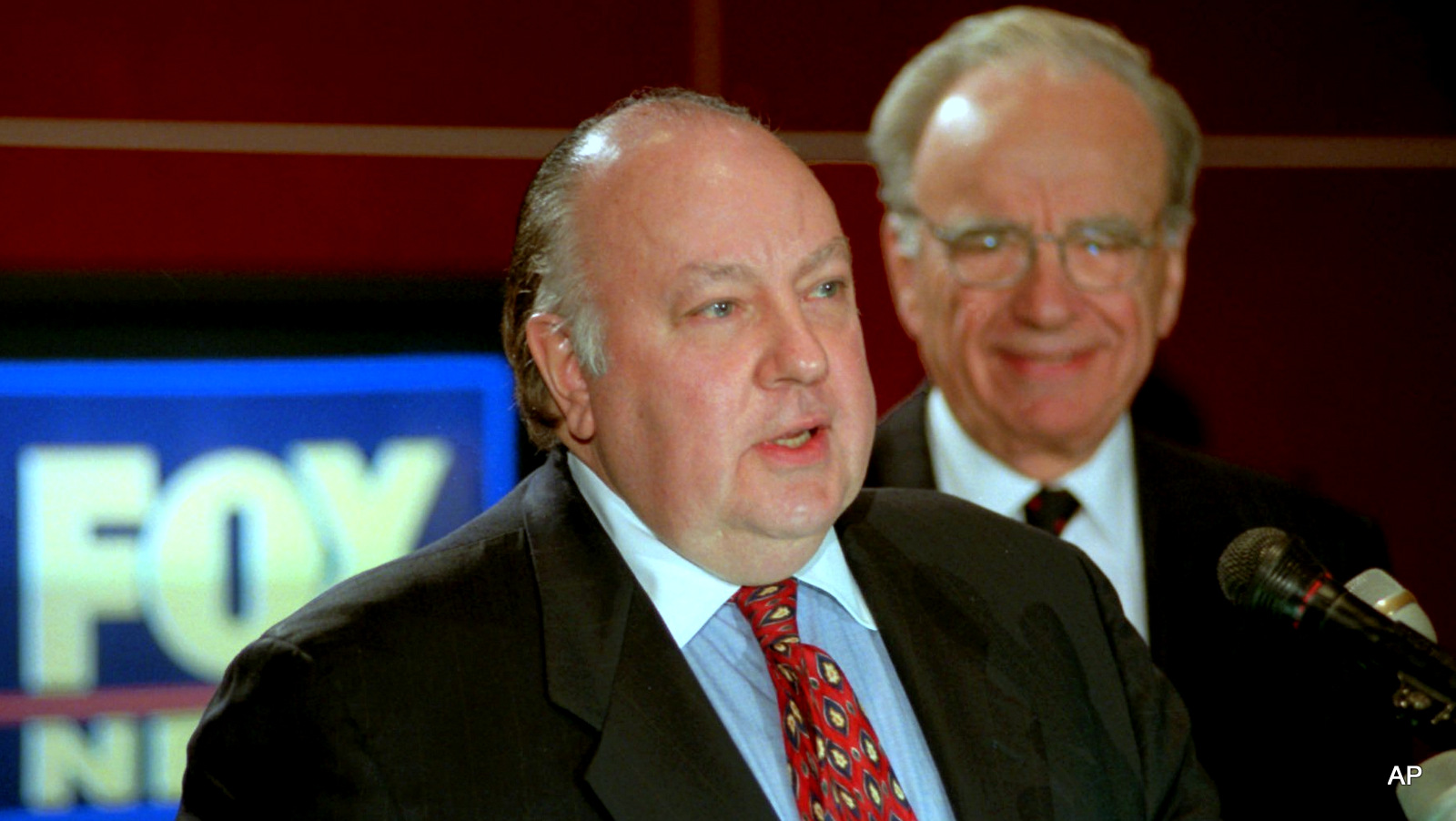 In this 1996 file photo, Roger Ailes, left, speaks at a news conference as Rupert Murdoch looks on after it was announced that Ailes will be chairman and CEO of Fox News. 21st Century Fox said Thursday, July 21, 2016, that Ailes is resigning immediately. Murdoch will assume the role of Chairman and acting CEO of Fox News Channel and Fox Business Network. 