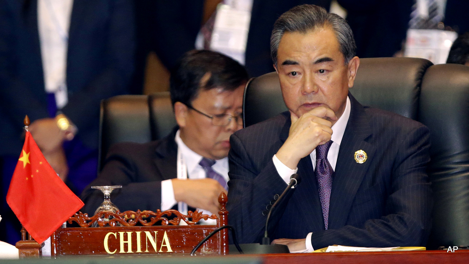 China's Foreign Minister Wang Yi, attends the 23rd ASEAN regional retreat meeting in Vientiane, Laos. Despite the Philippines taking on China in a territorial dispute in the South China Sea and winning big, other Southeast Asian nations with similar disputes who attended the meetings are backing down from their claims.