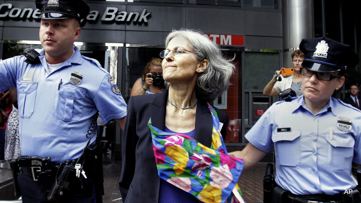 Green Party presidential nominee Jill Stein, is transported in restraints to be arrested after a sit-in at a downtown Philadelphia bank over housing foreclosures.