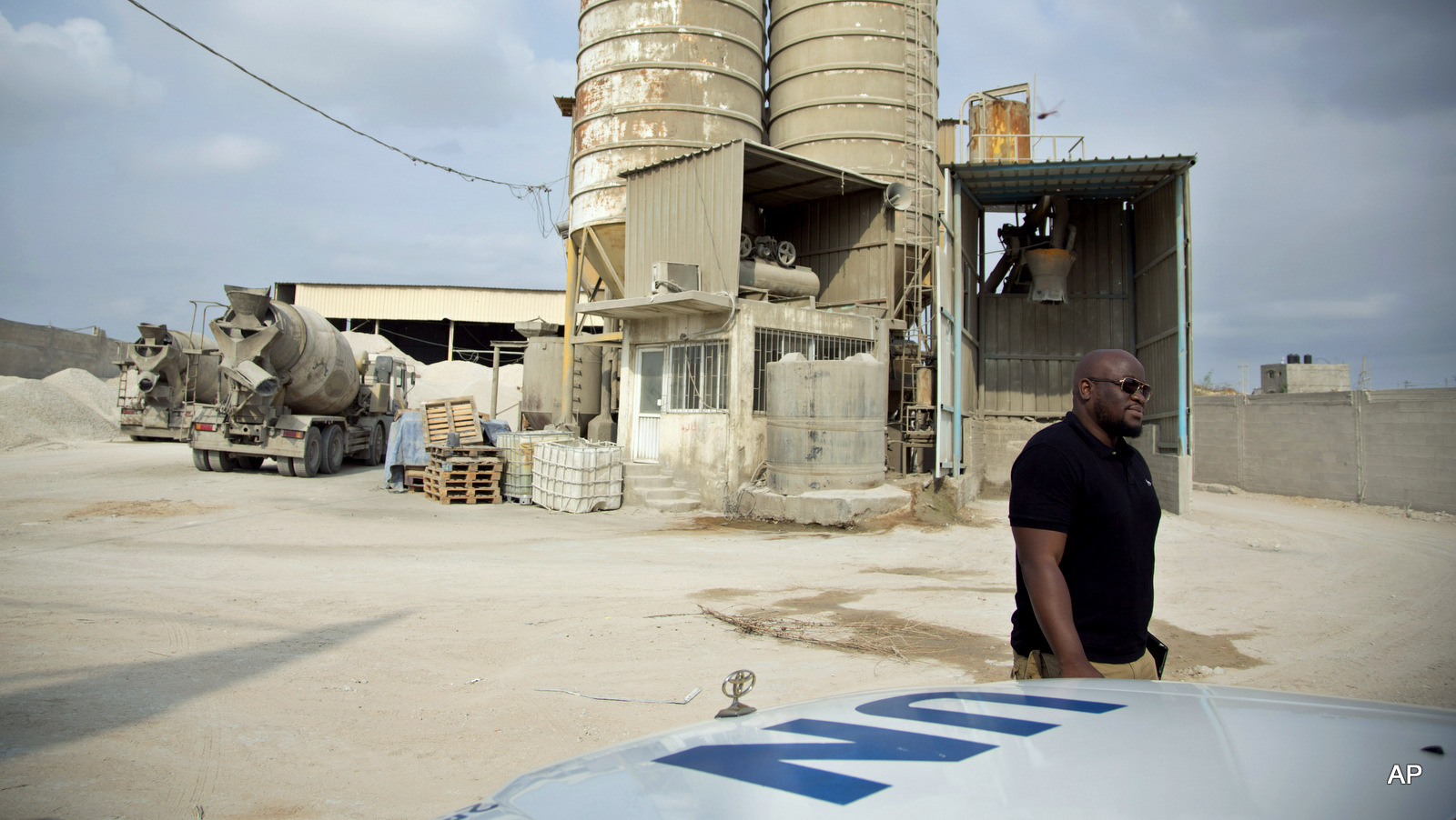 Keith Mathias-O'Chez, an inspector of building materials for the U.N. Relief and Works Agency, visits one of seven mixing concrete factories that are responsible for preparing the concrete for the U.N. projects in the Gaza Strip.
