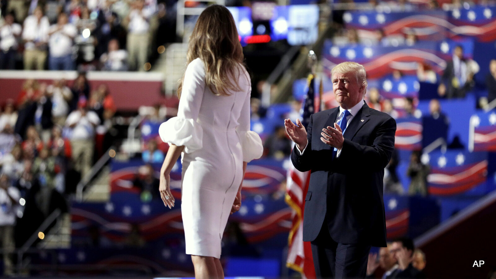 Republican presidential candidate Donald Trump applauses after with his wife Melania addresses the delegates during the Republican National Convention, Monday, July 18, 2016, in Cleveland.