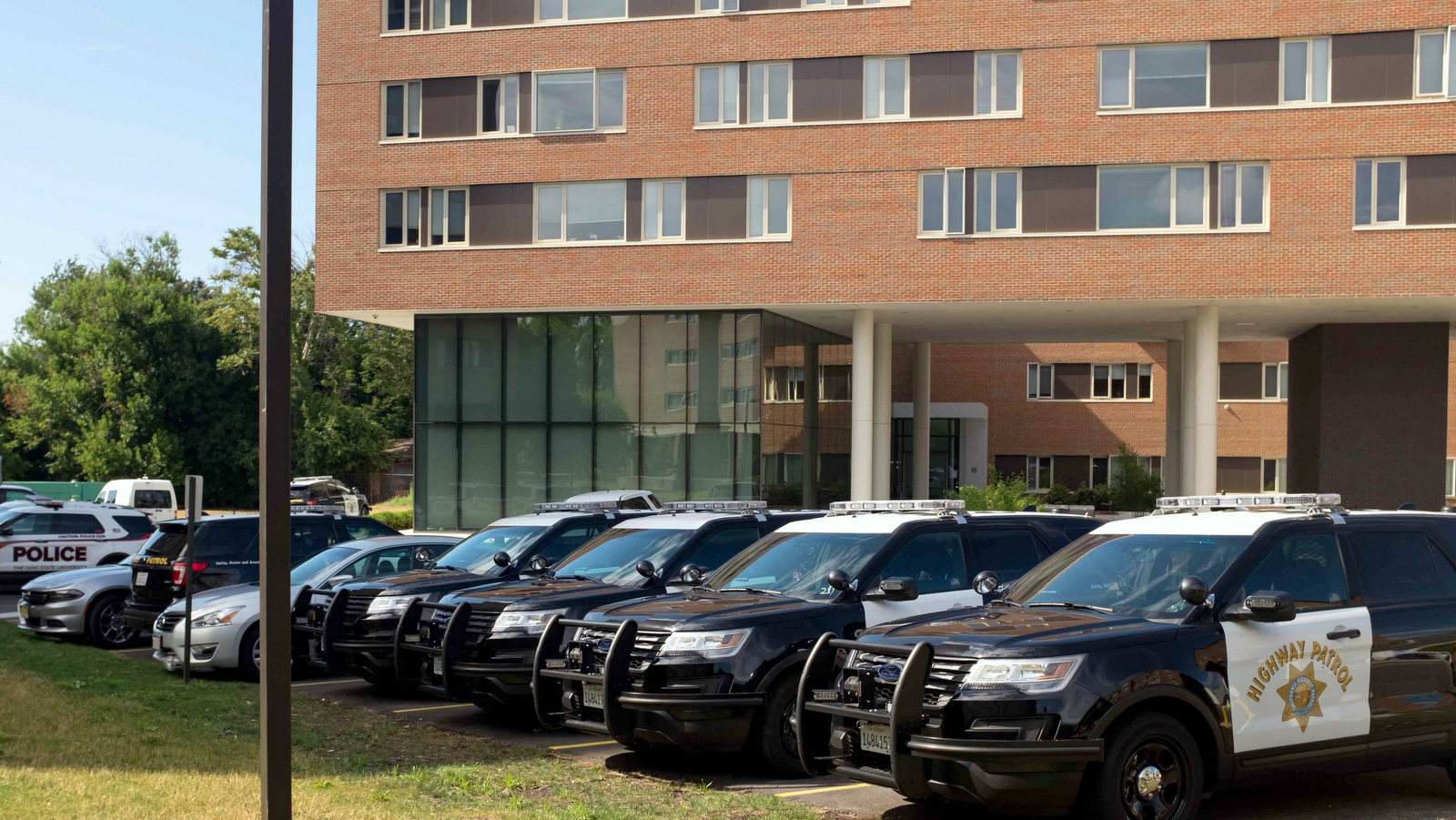 Police cruisers from across the country parked outside of a student resident hall at Case Western Reserve University in Cleveland, Ohio. Many of the dorms on the university have been converted into temporary barracks for out-of-state law enforcement during the RNC. (Photo: The Observer)