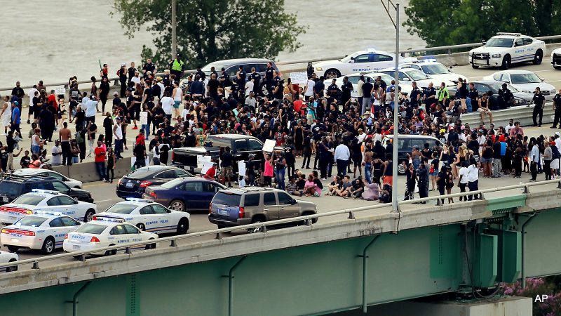 Black Lives Matter protesters gather on the Hernando Desoto Bridge in Memphis, Tenn., Sunday, July 10, 2016