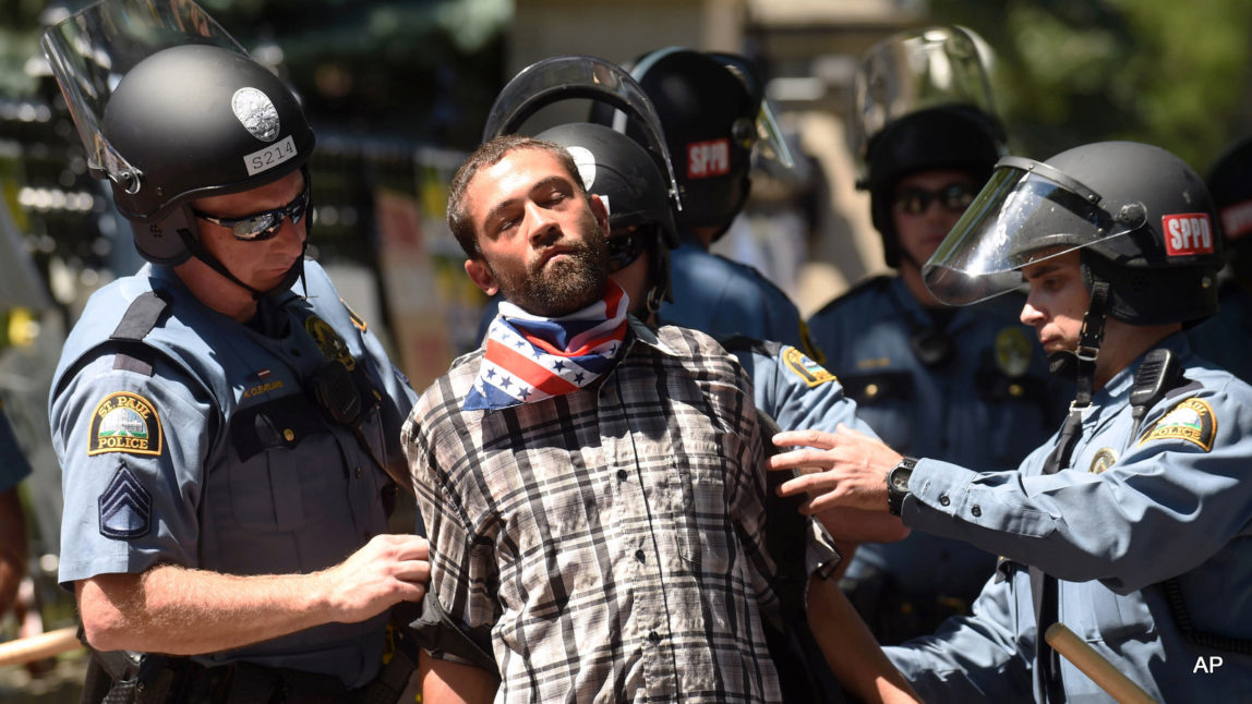 Joshua Lawrence is arrested by St. Paul police after protesters refused to move from in front of the Governor's residence on Summit Ave. in St. Paul, Minn. on Tuesday, July 26, 2016.