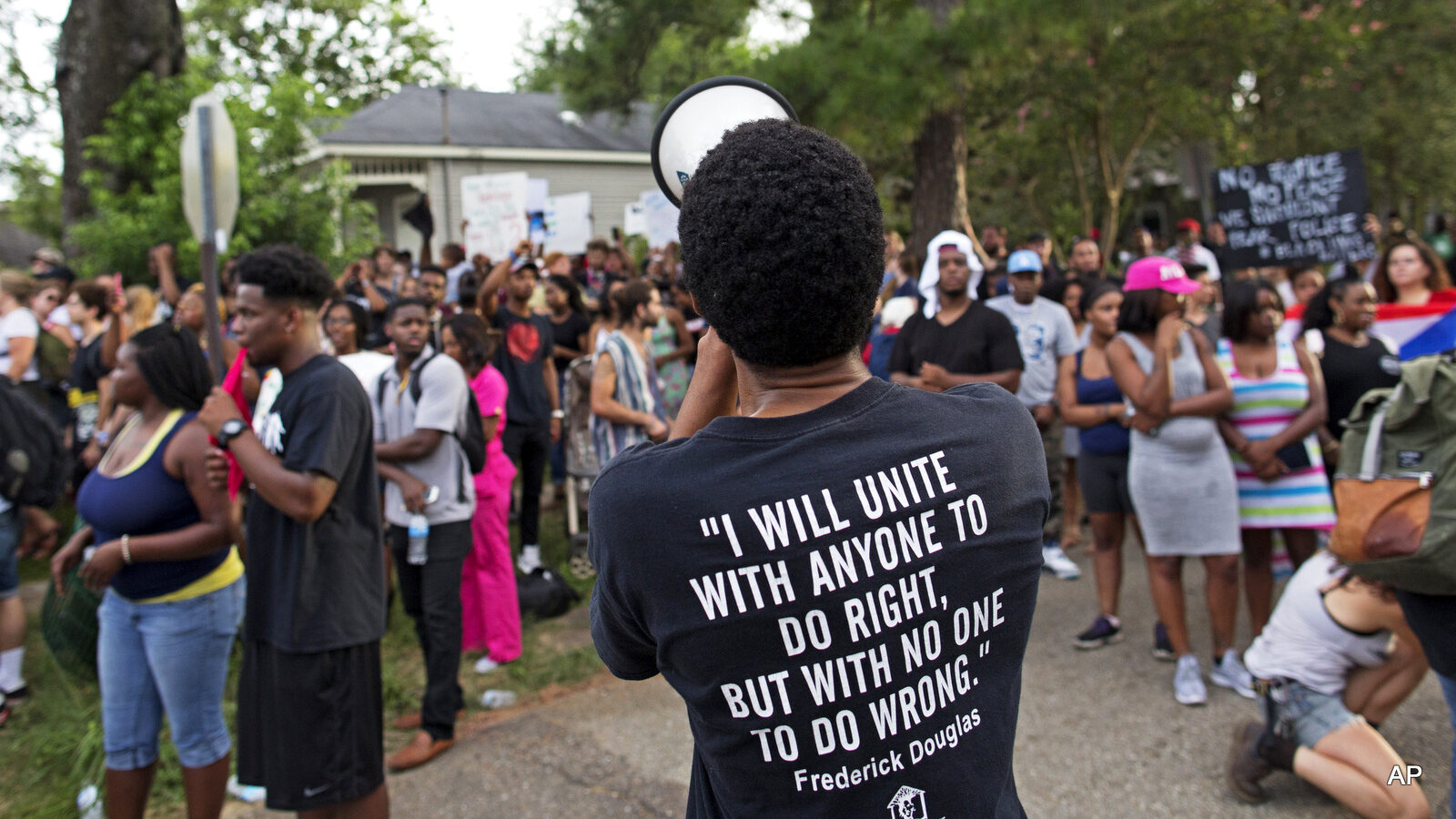 Protesters demonstrate a residential neighborhood in Baton Rouge, La. on Sunday, July 10, 2016.