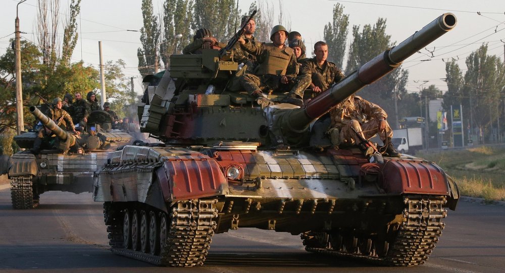 Soldiers from the Ukrainian army ride on tanks in the port city of Mariupol, southeastern Ukraine, Friday, Sept. 5, 2014.