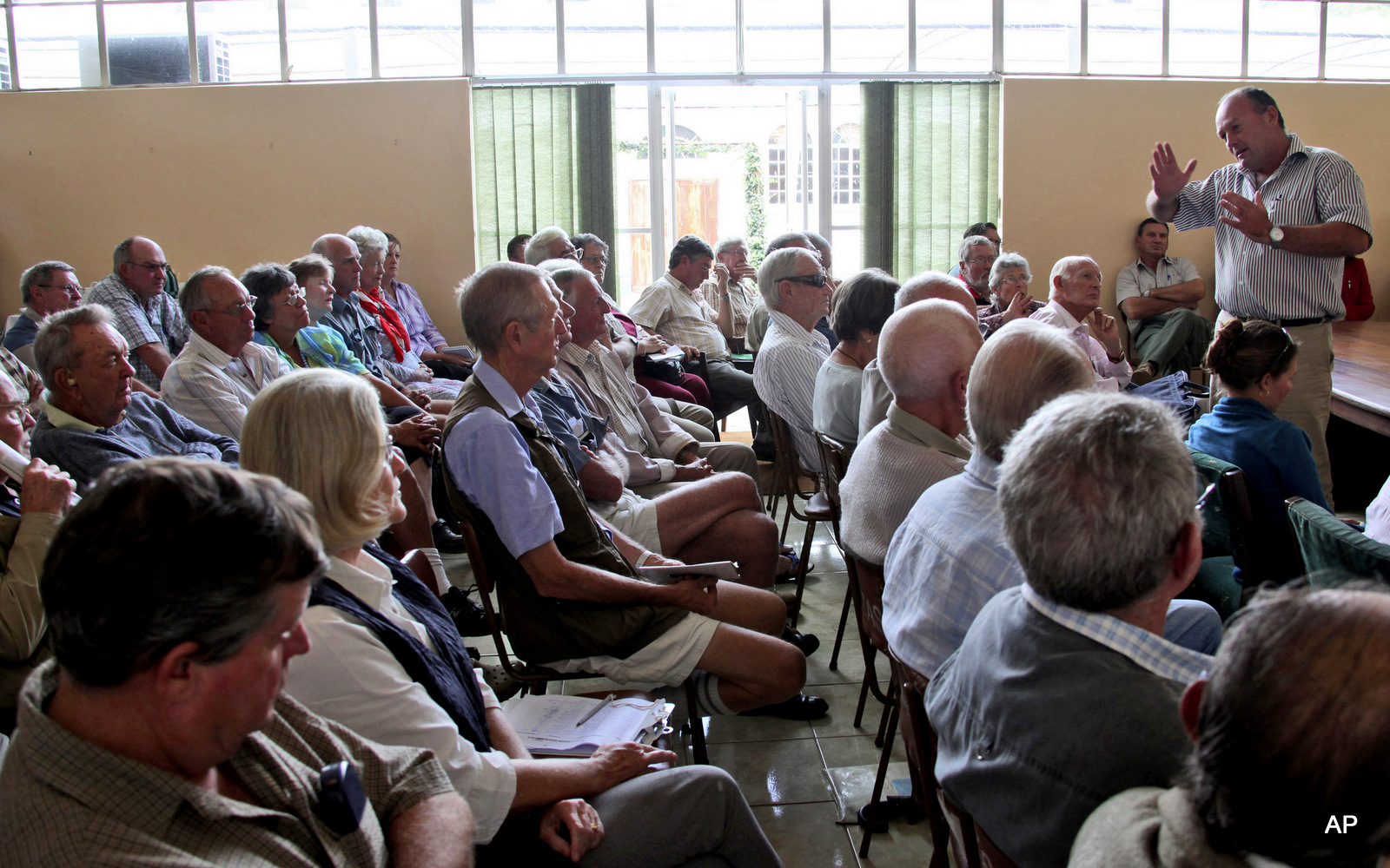 Charles Taffs, right, vice president of the Commercial Farmers Union addresses farmers at a meeting in Harare, Friday, Feb. 5, 2010. Commercial Farmers in Zimbabwe held a meeting to advocate for compensation for land seized during Zimbabwe's land reclamation. Mugabe, in power since Zimbabwe won independence from Britain in 1980, argues that the land was plundered by the country's European colonizers.