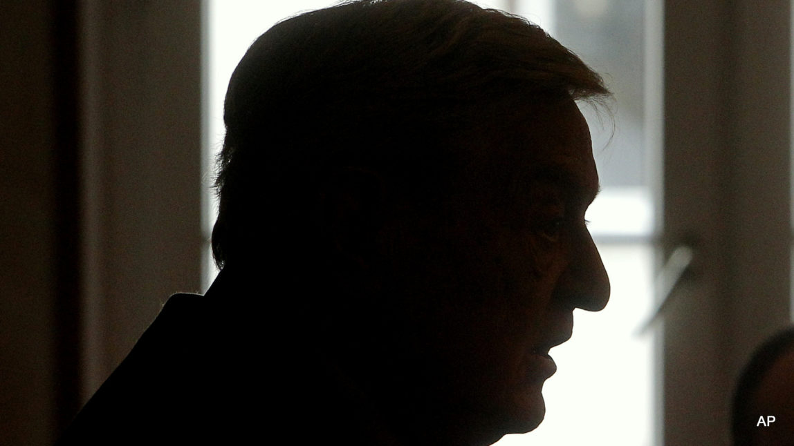 The silhouette of Georges Soros of the Soros Fondation, is pictured as he speaks to the media at the World Economic Forum in Davos, Switzerland, Wednesday, Jan. 25 ,2012.